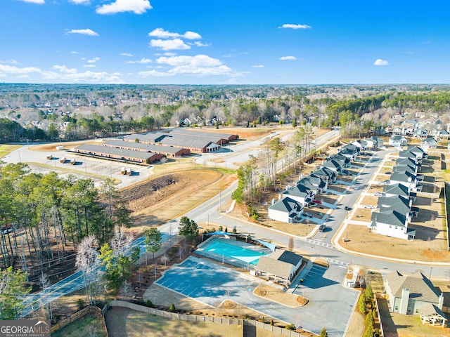 birds eye view of property with a residential view