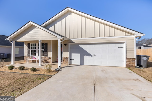 view of front of house with a garage and covered porch