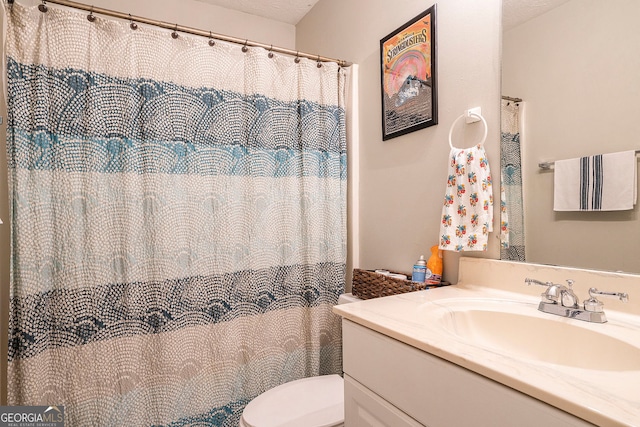 full bathroom featuring toilet and vanity