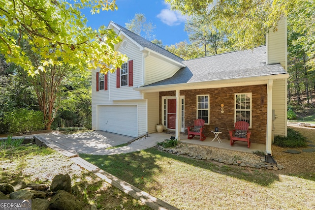 view of front of home with a chimney, a porch, a garage, driveway, and a front lawn