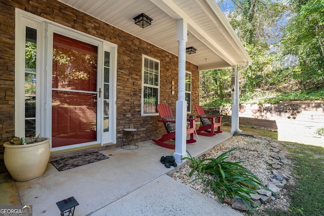 entrance to property featuring covered porch