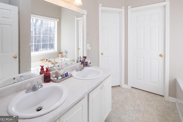 bathroom with vanity and a bathtub