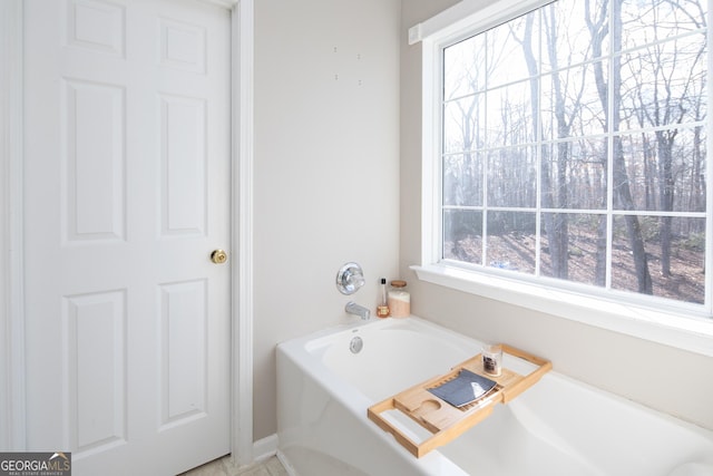 bathroom featuring a tub to relax in