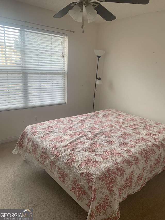 bedroom featuring carpet flooring and ceiling fan