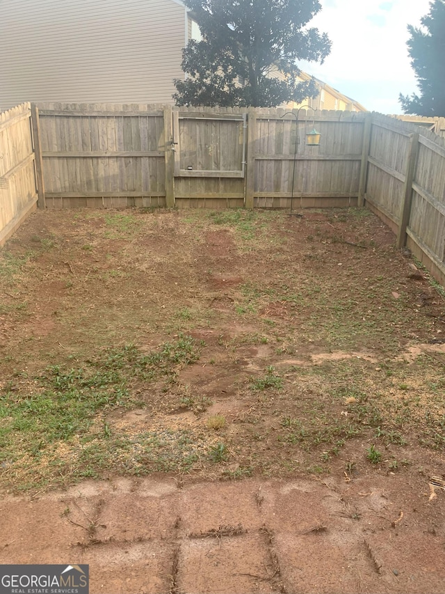 view of yard with a fenced backyard