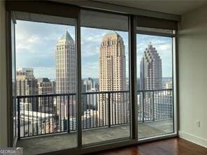 entryway featuring expansive windows and hardwood / wood-style floors