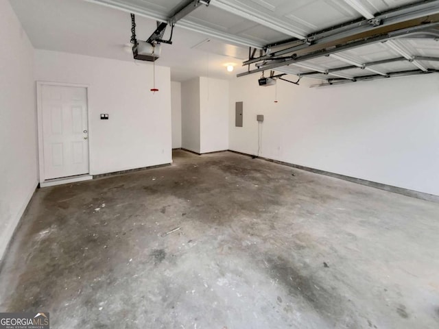 garage featuring a garage door opener and electric panel