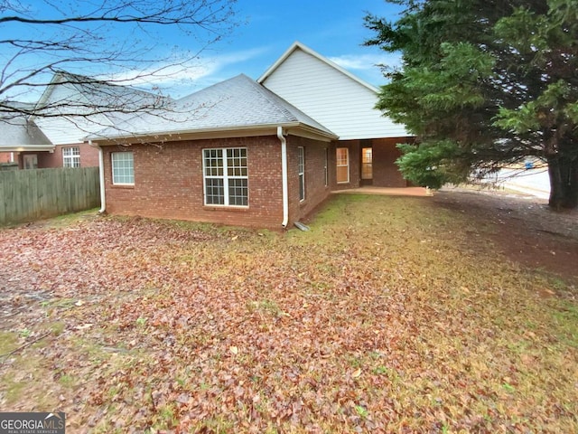 view of property exterior with a yard