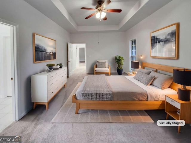 bedroom with a raised ceiling