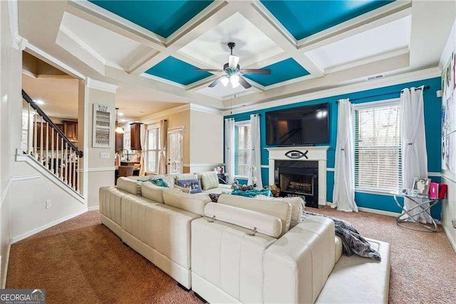 living room with carpet, coffered ceiling, and ceiling fan