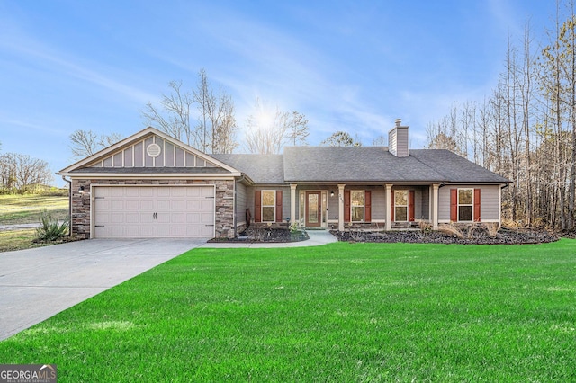 ranch-style house with a front lawn, covered porch, and a garage