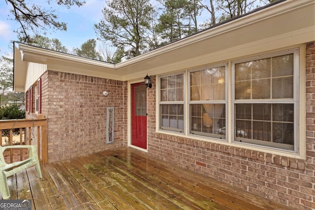 doorway to property with a wooden deck