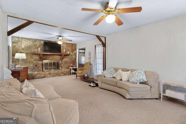 living room with ceiling fan, carpet floors, and a fireplace