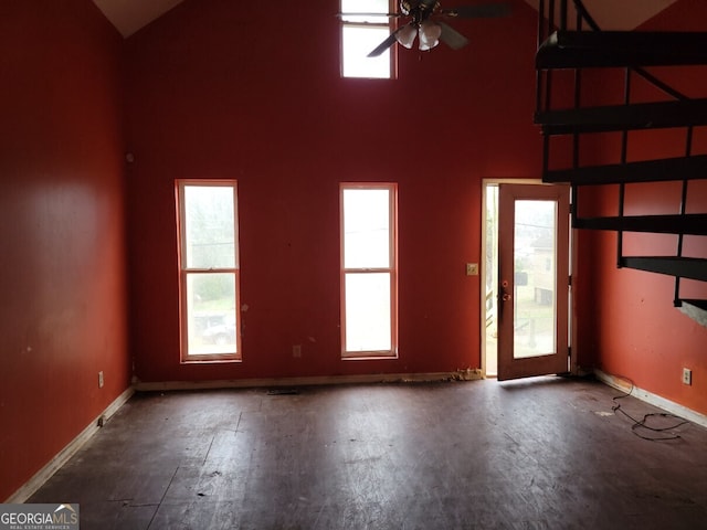 spare room featuring ceiling fan and high vaulted ceiling