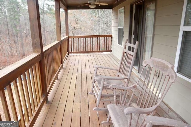 wooden deck with ceiling fan