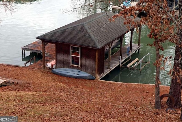 exterior space with a boat dock and a water view