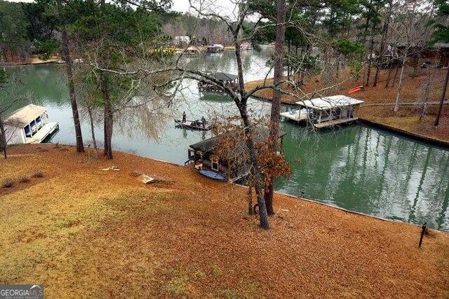 exterior space featuring a water view and a boat dock