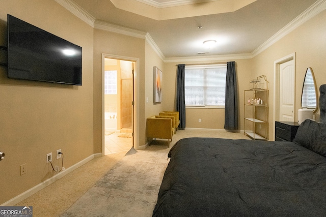 carpeted bedroom featuring crown molding and ensuite bathroom