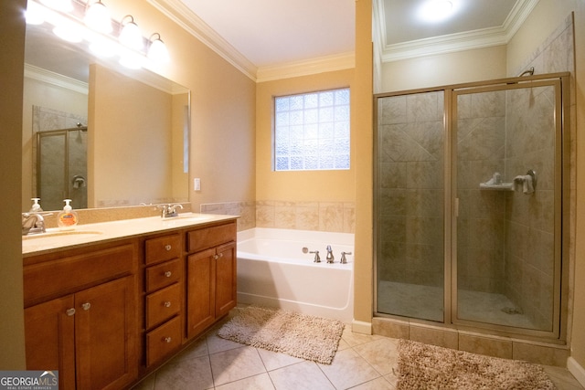 bathroom with tile patterned flooring, crown molding, shower with separate bathtub, and vanity