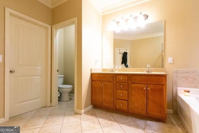 bathroom featuring crown molding, vanity, tile patterned floors, toilet, and a bathing tub