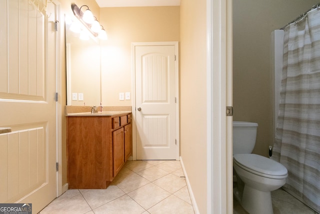 bathroom featuring walk in shower, vanity, toilet, and tile patterned flooring