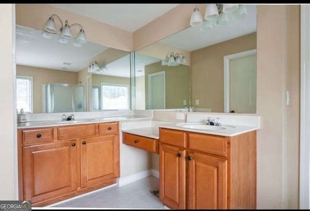 bathroom with vanity and an enclosed shower