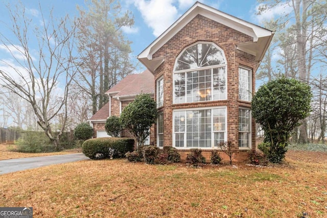 view of property exterior with a yard