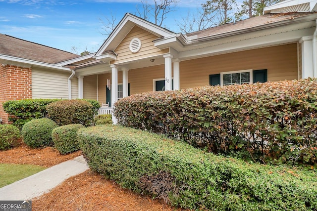 doorway to property with a porch