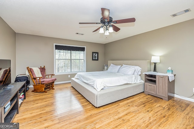 bedroom featuring light hardwood / wood-style floors and ceiling fan