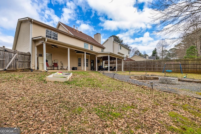 back of property with a patio area and ceiling fan