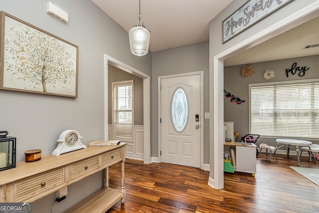 entrance foyer with dark hardwood / wood-style floors