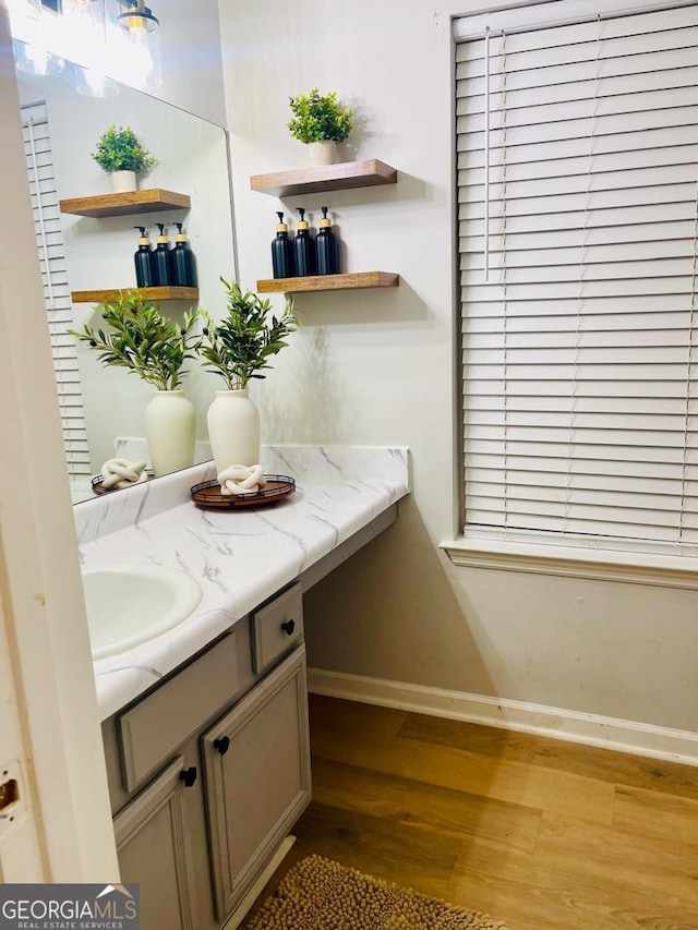 6594 Meadow Green Cir, Peachtree Corners, GA 30092 - bathroom featuring wood finished floors, vanity, and baseboards