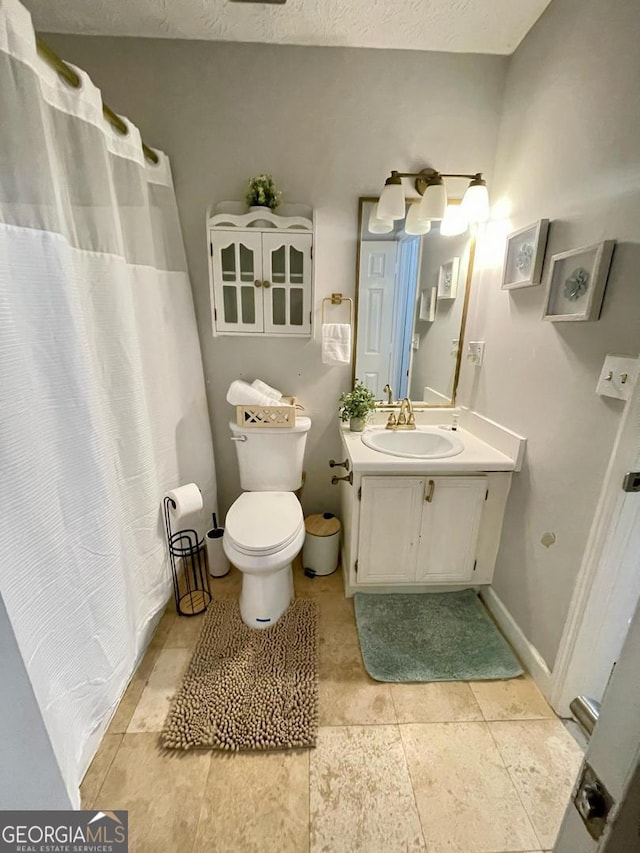 6594 Meadow Green Cir, Peachtree Corners, GA 30092 - full bath featuring vanity, toilet, baseboards, and a shower with curtain
