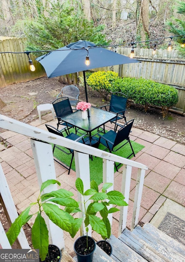 6594 Meadow Green Cir, Peachtree Corners, GA 30092 - fenced backyard with a patio and outdoor dining space