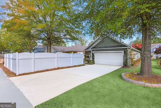 view of front facade featuring a garage and a front lawn