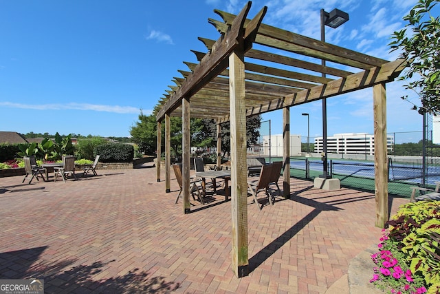 surrounding community with a pergola and tennis court