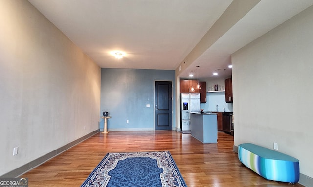 living room with sink and dark hardwood / wood-style flooring