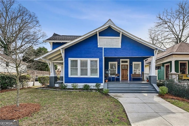 view of front of house featuring a porch and a front lawn