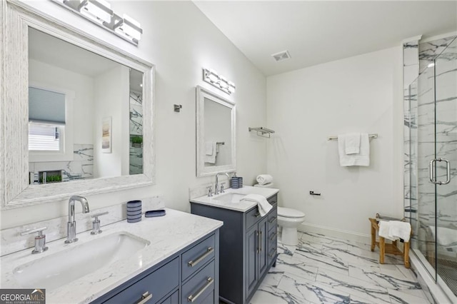 bathroom featuring an enclosed shower, vanity, and toilet