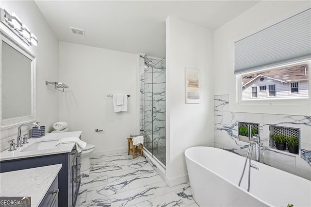 full bathroom with vanity, toilet, and separate shower and tub