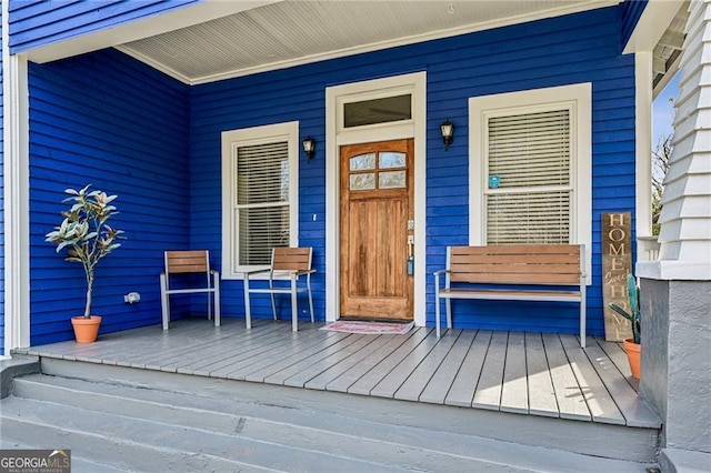 doorway to property with a porch