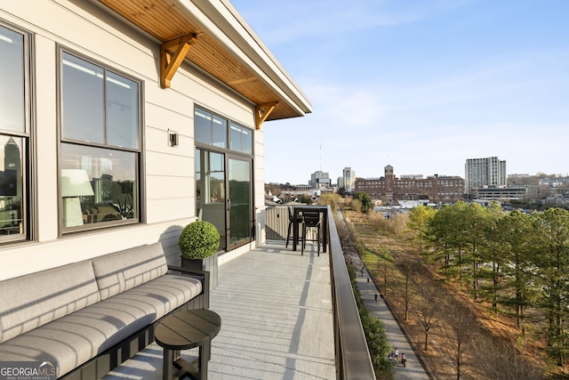 wooden terrace with a city view