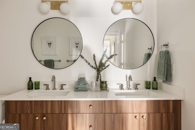 bathroom with a sink and double vanity