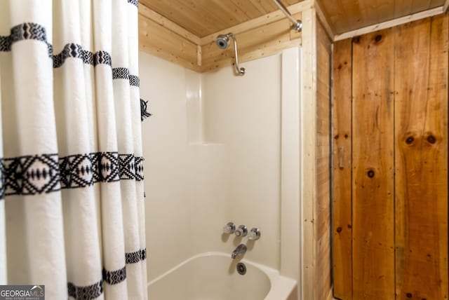 bathroom featuring shower / bath combo with shower curtain and wood ceiling