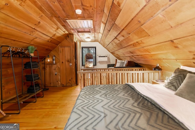 bedroom with hardwood / wood-style floors, vaulted ceiling, wood walls, and wood ceiling