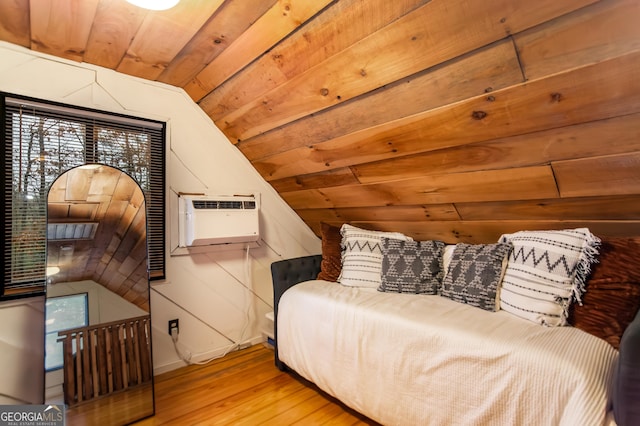 bedroom with an AC wall unit, light wood-type flooring, lofted ceiling, wood ceiling, and wooden walls