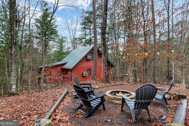 view of yard with a fire pit