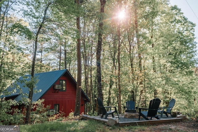 view of outdoor structure featuring an outdoor fire pit