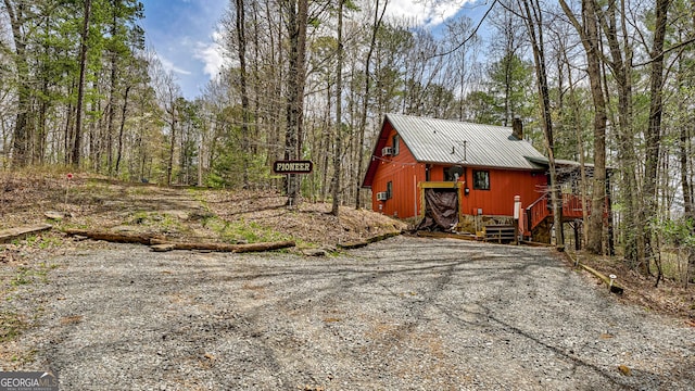 30 Cheyenne Trl, Blue Ridge, GA 30513 - view of side of home featuring a chimney and metal roof