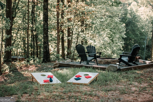 view of yard with a fire pit